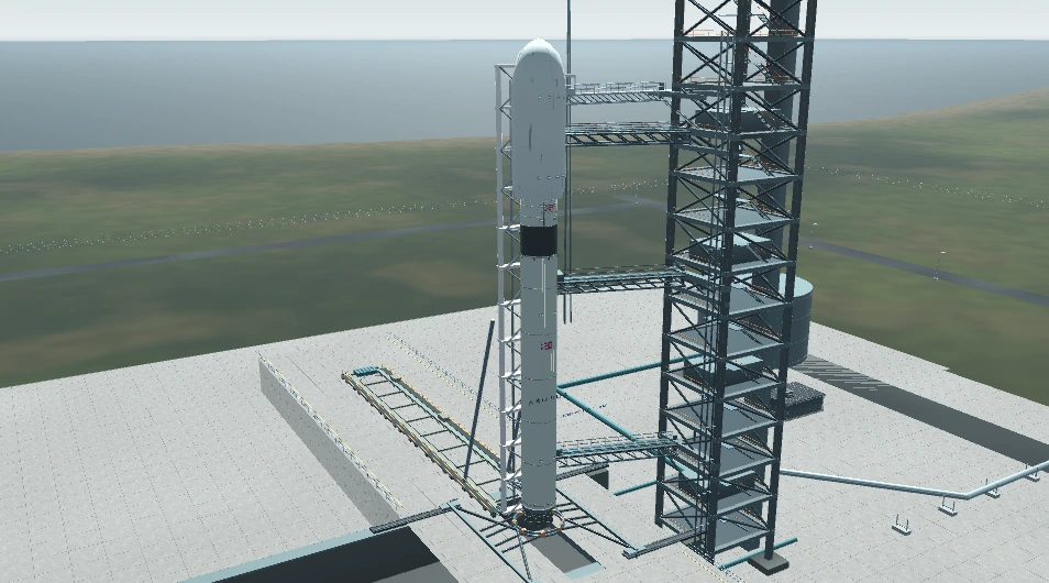 The complete Aurora rocket upright on its launch mount beside the service tower, ready for launch.